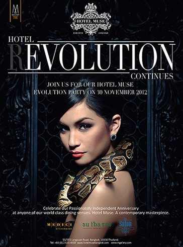 Thai Lady posing with a snake at the entrance of Hotel Muse